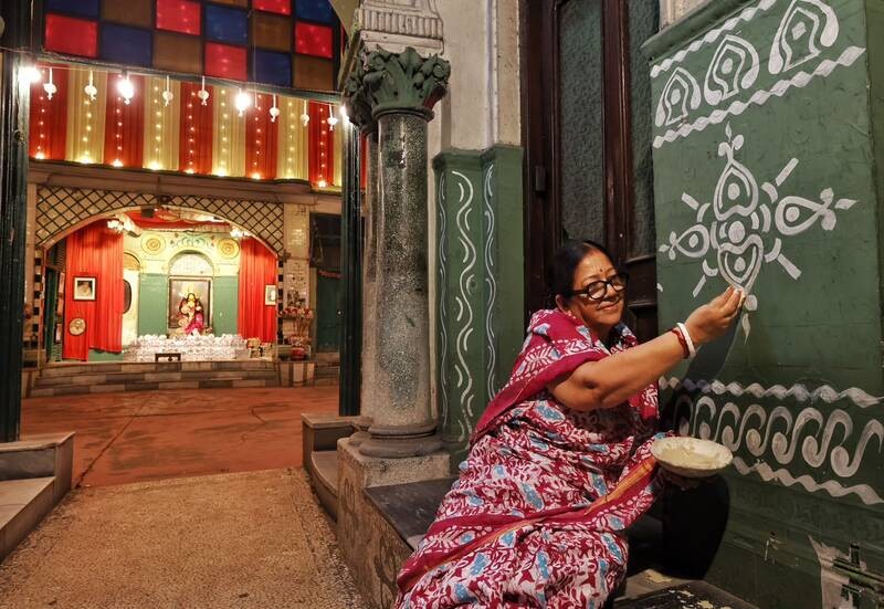 In Images: Kolkata gears up for Lakshmi Puja with idol sales at Kumartuli, alpana decorations at homes