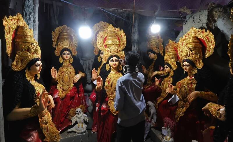 In Images: Kolkata gears up for Lakshmi Puja with idol sales at Kumartuli, alpana decorations at homes