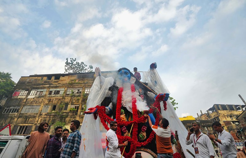 In Images: Kolkata's Fata Kesto Kali idol arrives at pandal in grand procession