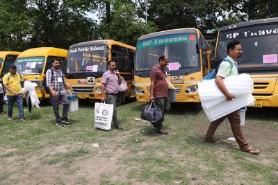 Phase 1 of Bengal polls tomorrow; polling personnel collect EVMs, other materials from a Siliguri dispersal centre